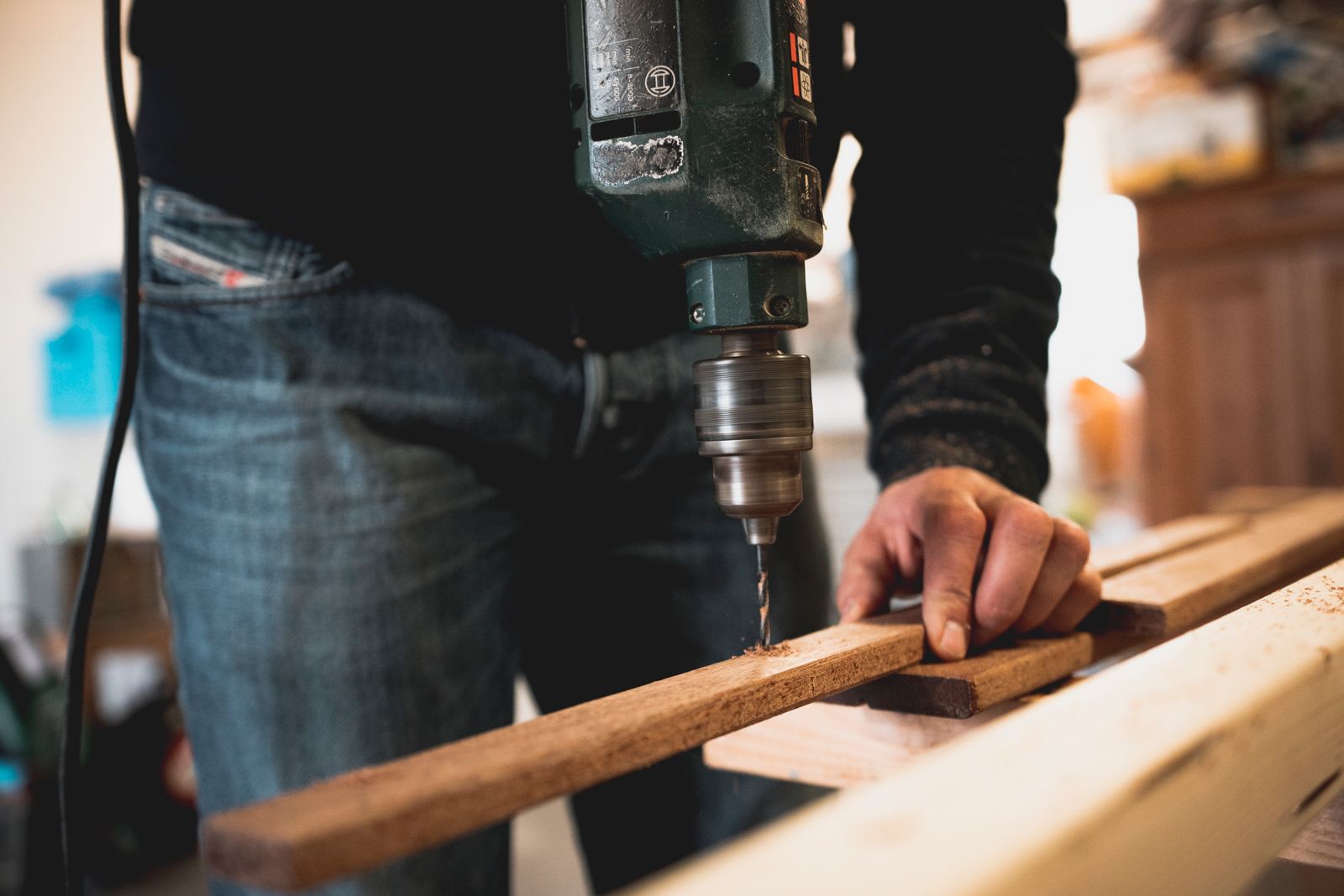 Hands working timber