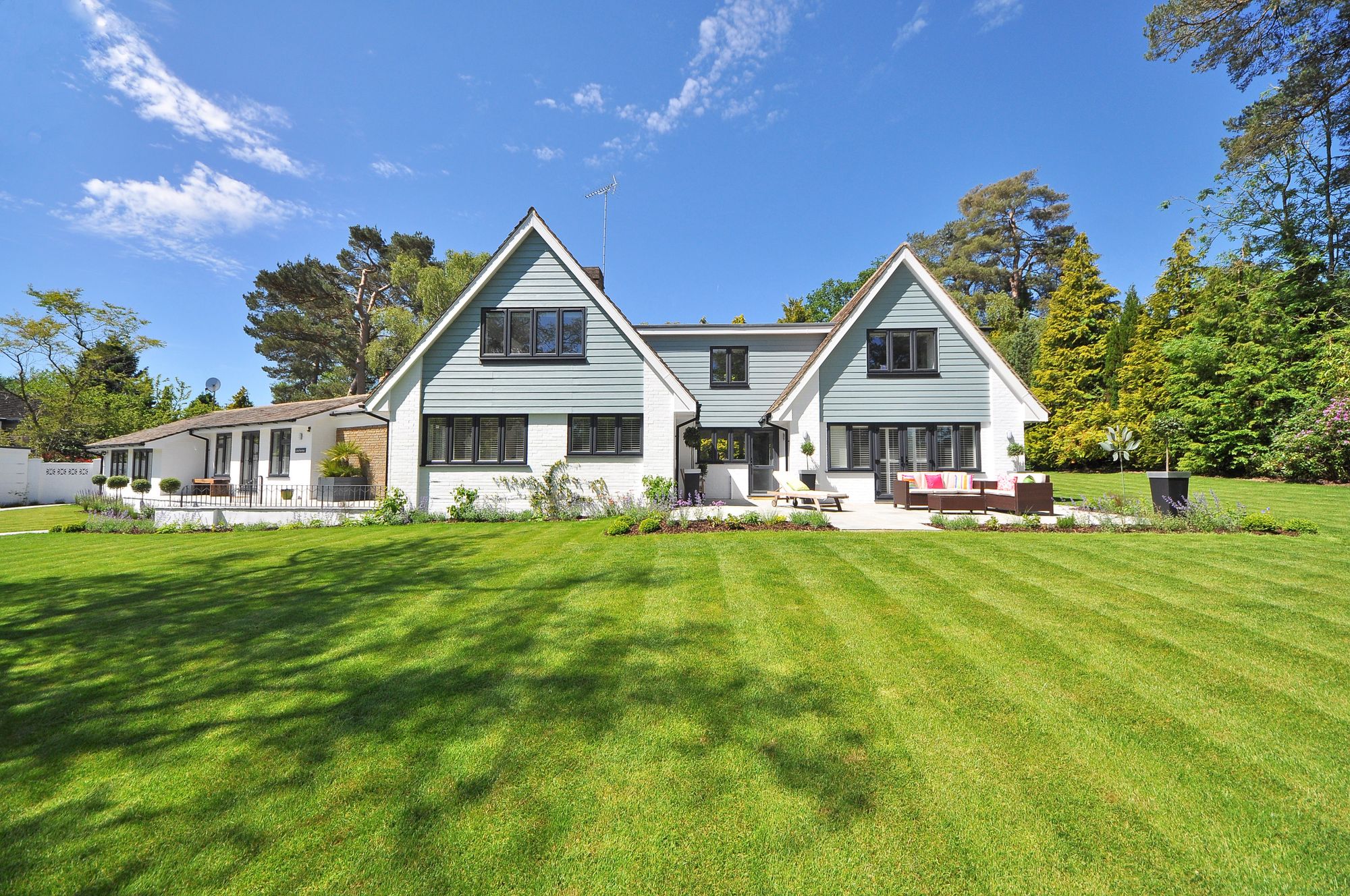 Timber cladding, patio, and garden as one composition